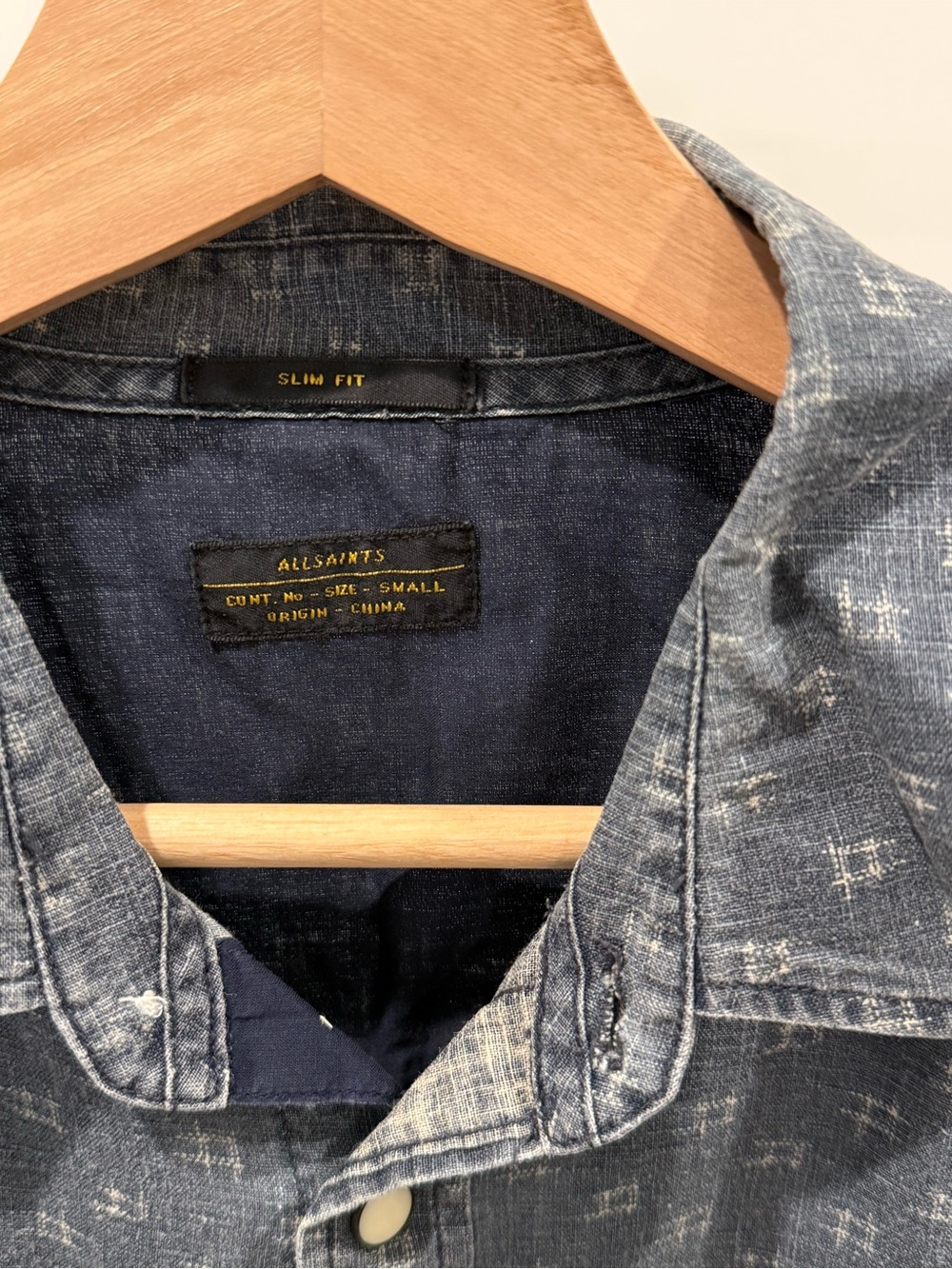 AllSaints Men’s Slim Fit button down shirt with pearl button detail.
